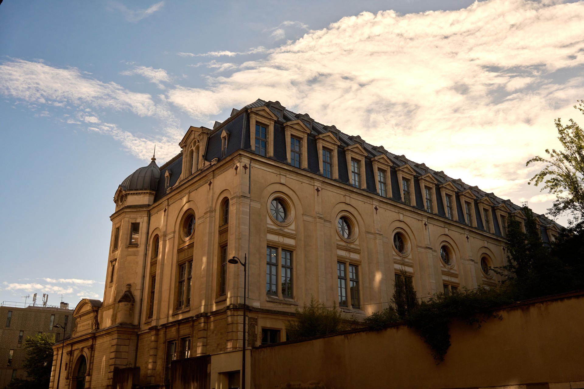French architecture building with mansard roof and dormers