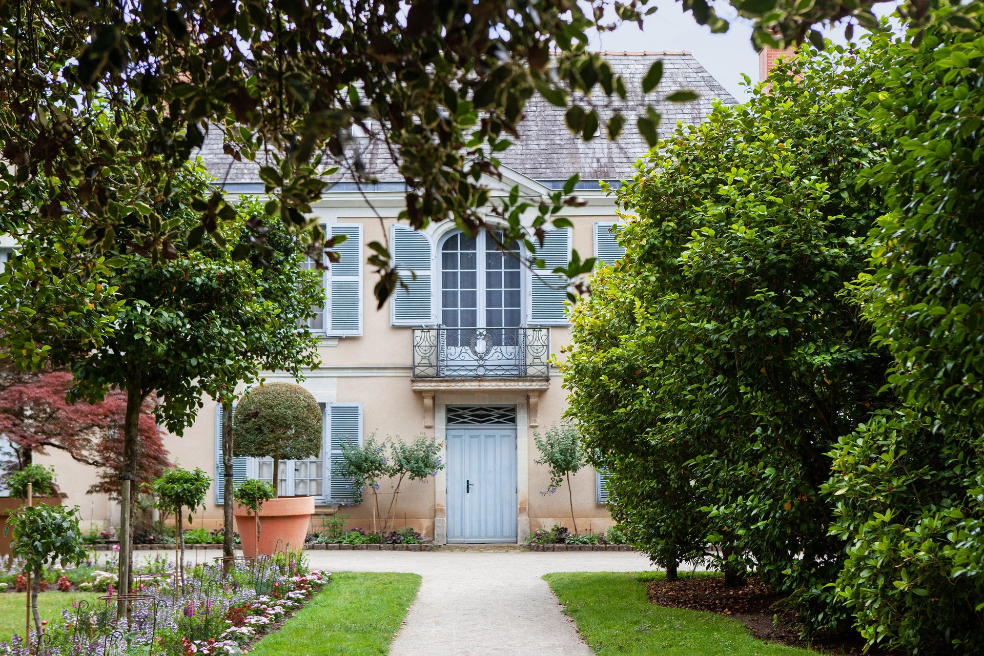 Facade of a classic architecture and garden in France